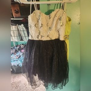 White flower and sequin top with black, sparkly tutu dress + sheer layers